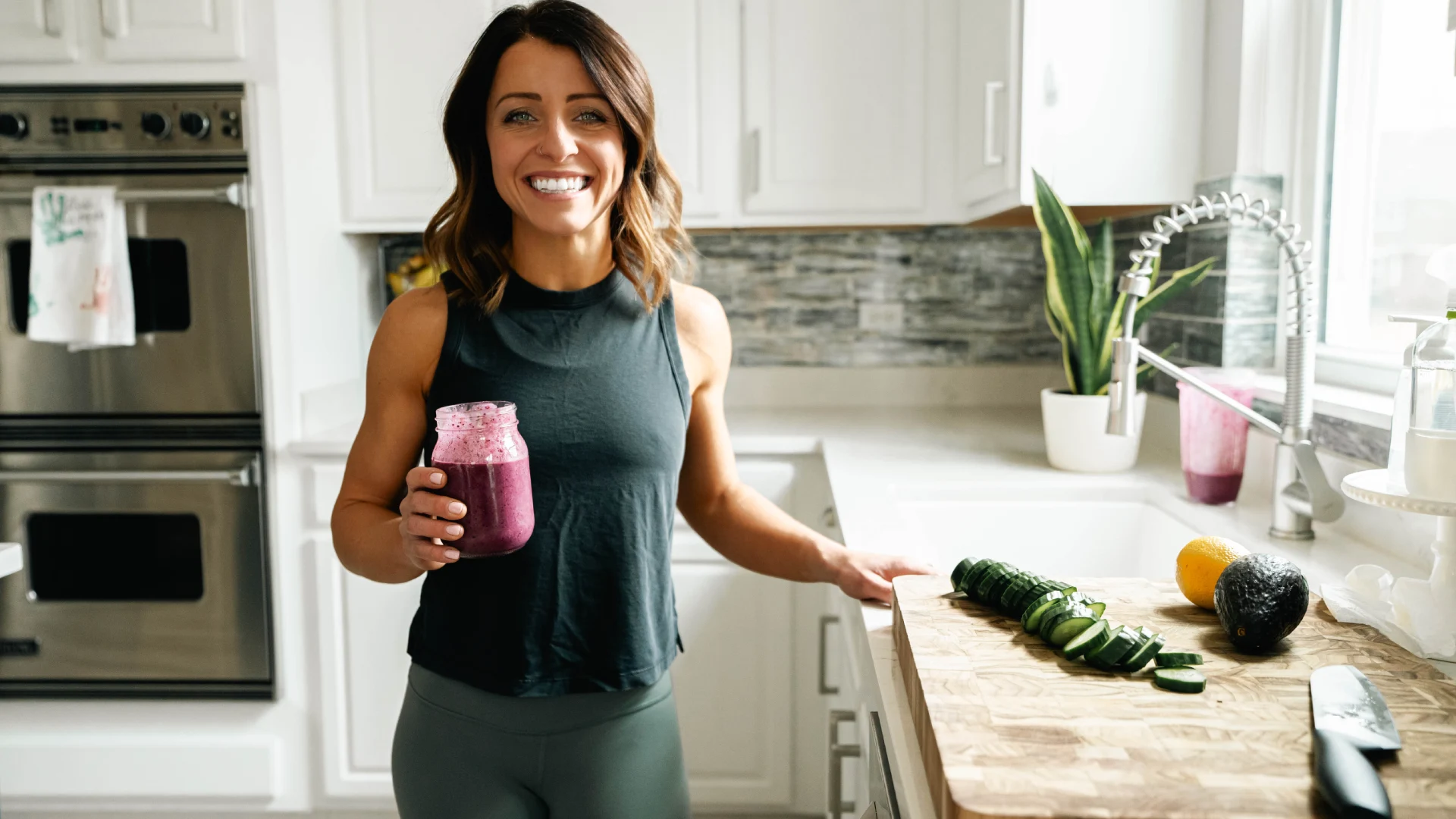 Carmela preparing a nutrient-dense smoothie in her kitchen